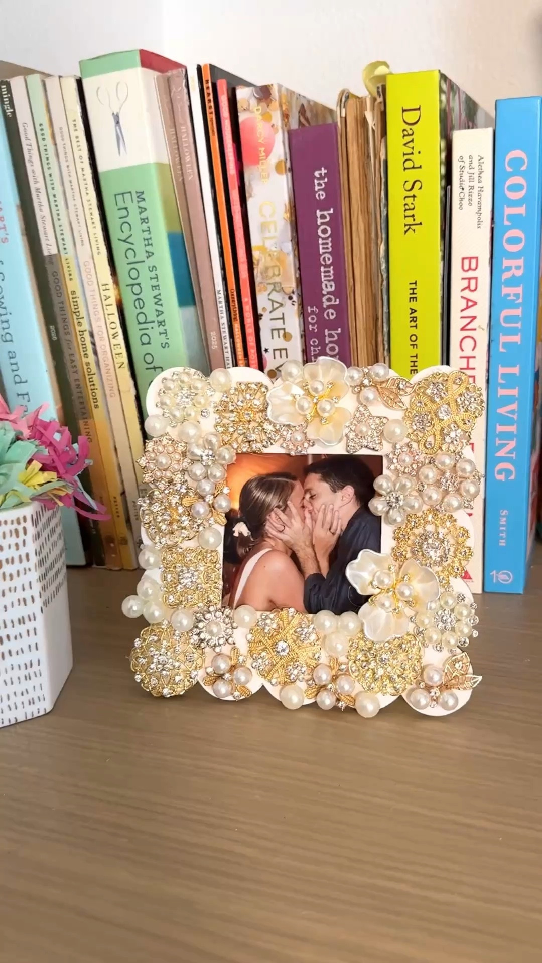 I put our wedding photo in this frame and genuinely couldn’t stop staring at it 🤍

a plain wooden frame, a bag of pearls, gemstone brooches, and some flatback charms are all you need! And your trusty hot glue gun. the whole thing cost less than $20 and it looks like something you’d find in a boutique for $150.
it works for any photo that means something to you — wedding, engagement, graduation, a picture of your best friends from ten years ago that deserves better than a basic black frame.

you can make it completely your own depending on your space and your style — all pearl, mixed metals, full gold, whatever feels right.
save this one for later 🤍 #ltkgift

#LTKHome #LTKWedding #LTKMothersDay