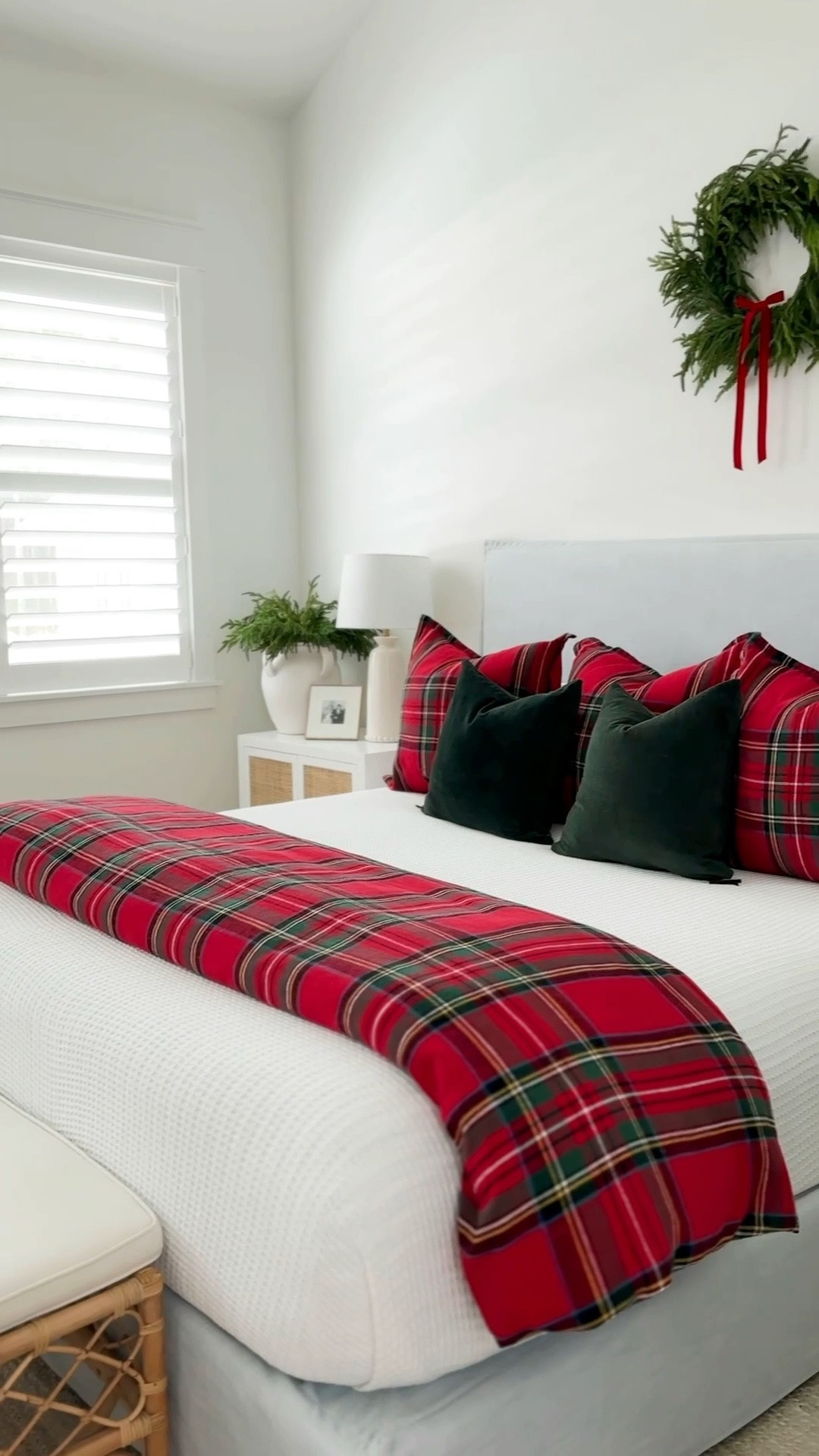 A view of our blue striped wallpaper and Christmas bedroom with vaulted ceilings, a light blue linen bed, white and red plaid bedding, dark green velvet pillows, a wreath with red velvet bow above the bed, bead chandelier, rattan nightstands, a rattan bench, and white jute rug. See our full Christmas home tour here: https://lifeonvirginiastreet.com/2024-christmas-home-tour/. #ltkholiday #ltkhome #ltksalealert #ltkfindsunder50 #ltkfindsunder100 #ltkseasonal #ltkstyletip 


#LTKHoliday #LTKSaleAlert #LTKHome