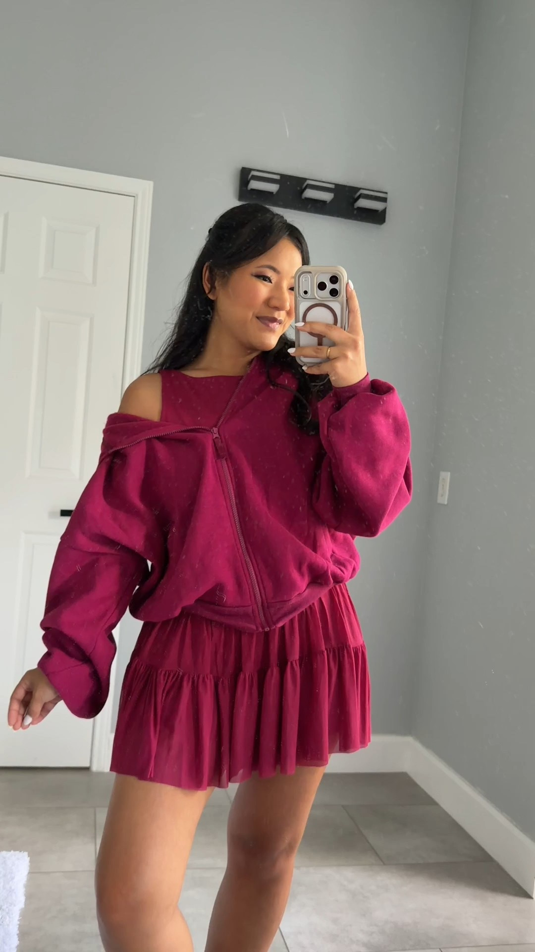 Blogilates Women's Ballerina Skort wearing size medium. Blogilates Women's Boatneck Crisscross Tank Top wearing size large. Blogilates Women's Marshmallow Full Zip Hooded Sweatshirt wearing size medium. 