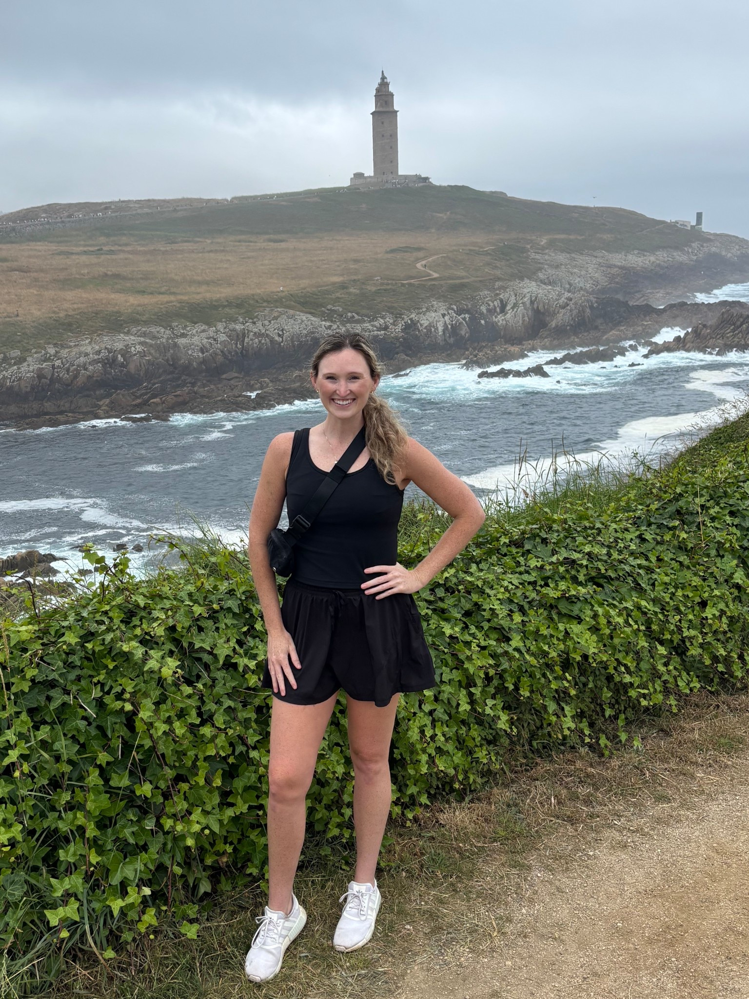 Casual activewear hiking or tennis/pickleball outfit. Comfortable summer activewear travel outfit. Black stretchy flattering workout tank (sized up to L), flowy shorts with build in shorts underneath, crossbody bag 

#LTKActive #LTKFindsUnder50 #LTKTravel