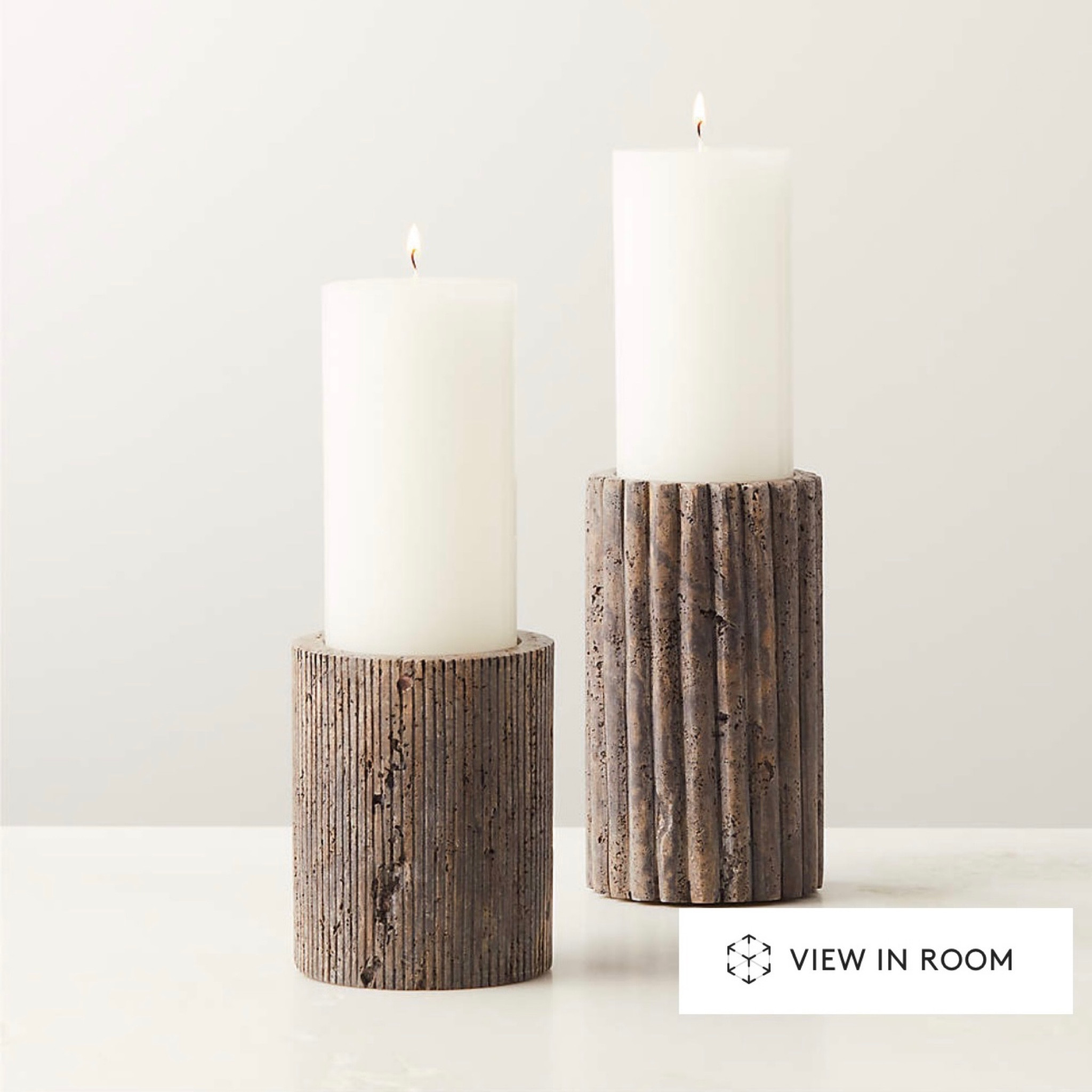 Stunning, earthy, ribbed travertine pillar candle holders. Both are on a limited time sale. Run! 

#LTKFind #LTKsalealert #LTKhome