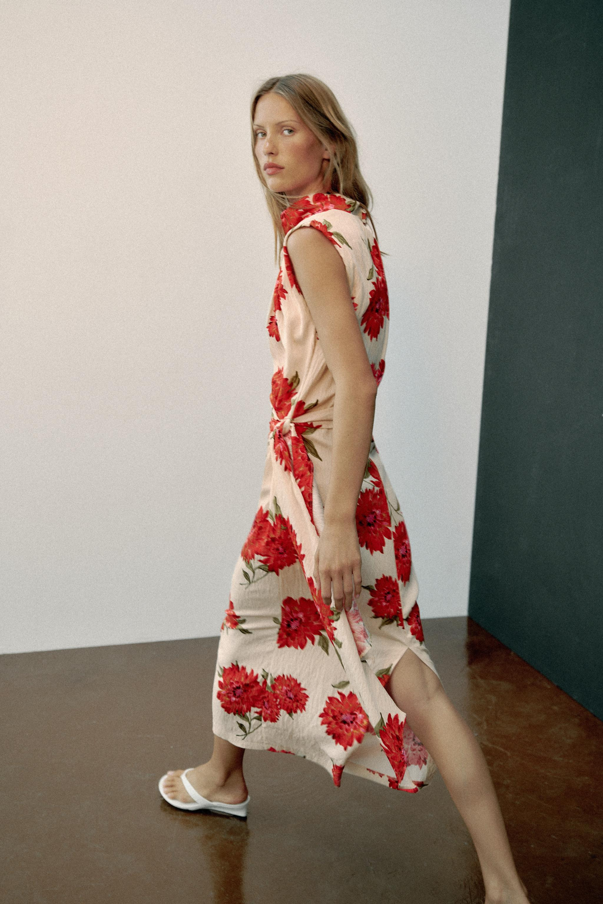 Draped-neck dress with sleeveless design and pleated shoulders. Features a matching fabric belt a... | Zara US