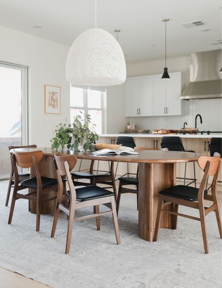 Open concept dining room with mid-century moments. Home decor, dining table, dining chairs, lighting, rug. 

Dining room, mid century, interior design.



#LTKunder100 #LTKhome #LTKunder50