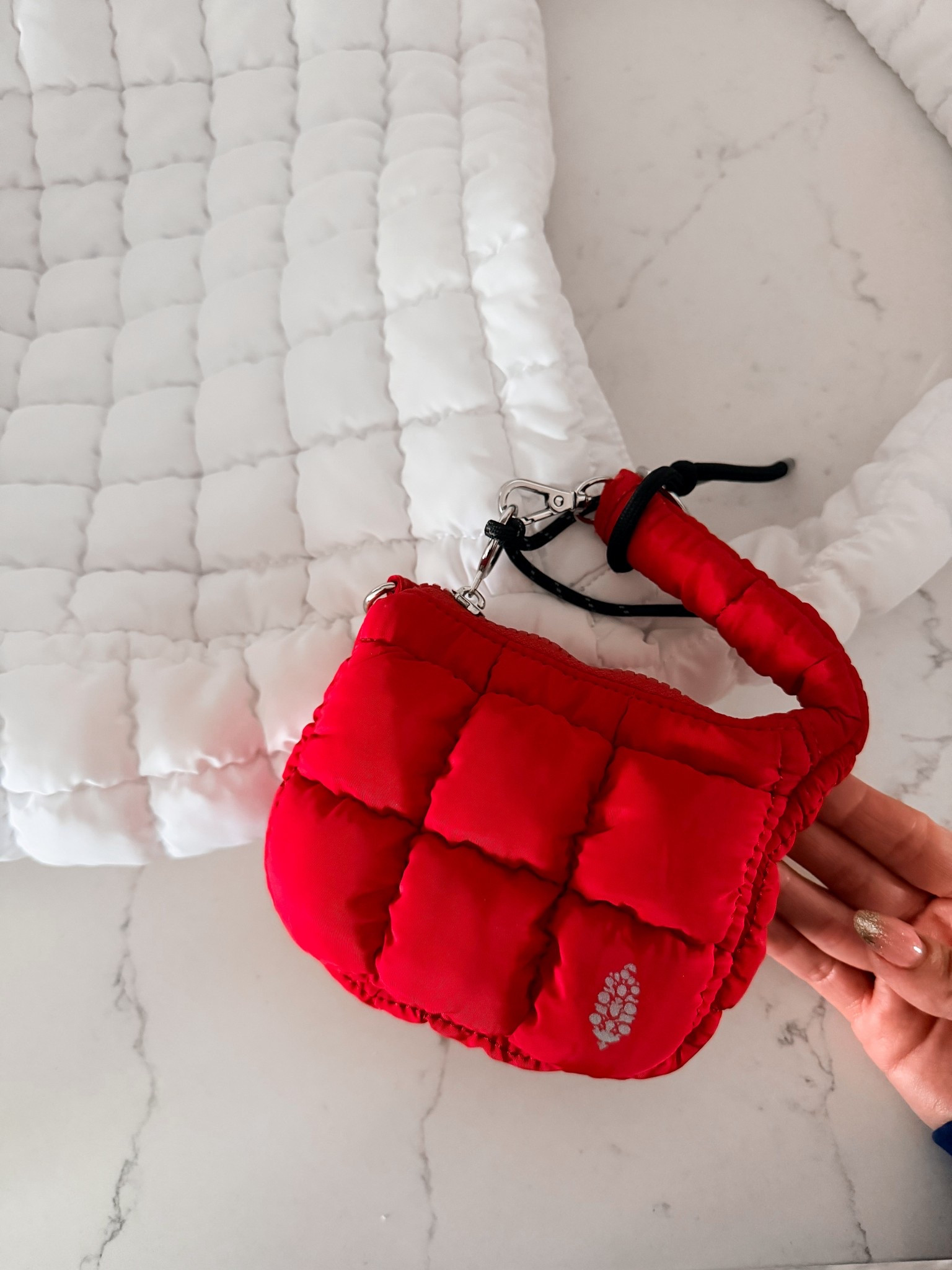It’s the Free People Quilted Micro Pouch.

Perfect for when you’re heading out the door and $20!  

Available in 9 other colors.  

#LTKmomlife #LTKSeasonal #LTKActive