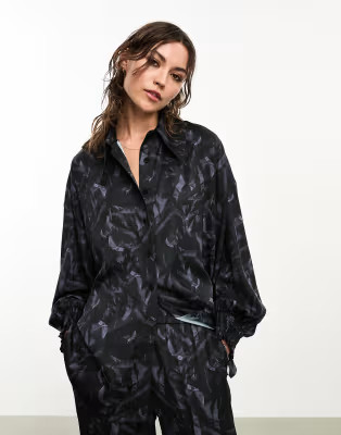 AllSaints x ASOS exclusive Charli co-ord satin shirt in black | ASOS | ASOS (Global)