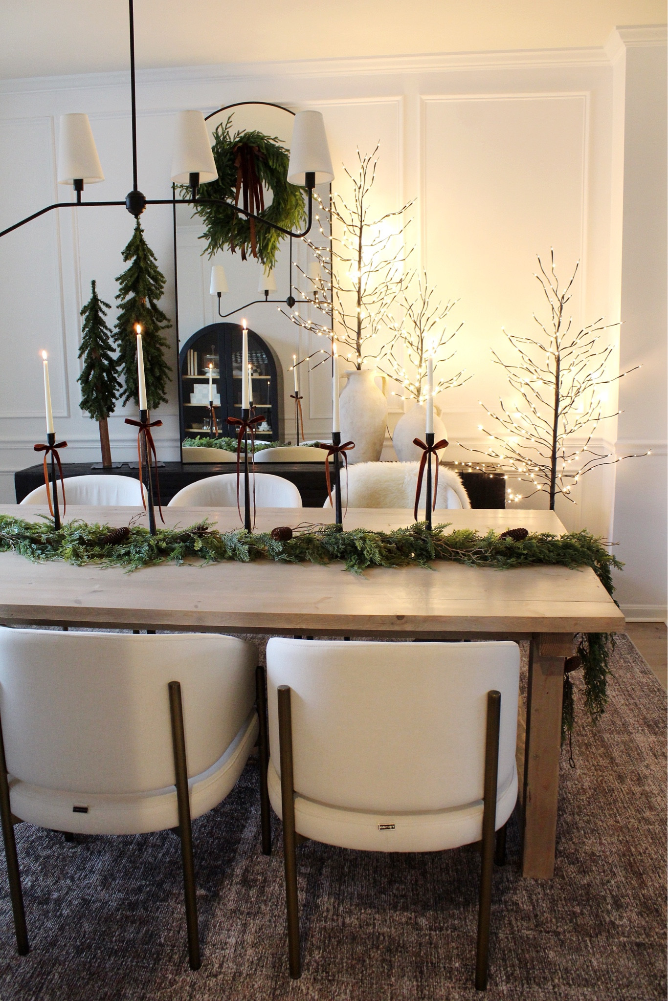 Holiday dining room, dining table, dining chairs, rug, Christmas tree, mirror, chandelier, candle holder, candles, ribbon, console table, cabinet, wreath 



#LTKHome #LTKHoliday #LTKSeasonal