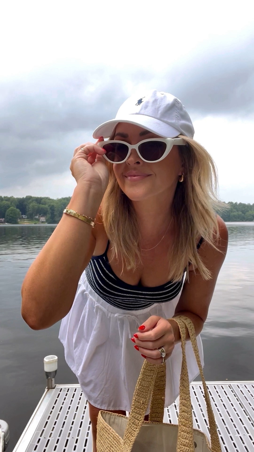 Mom, Style pool day, lake day, beach day, outfit idea. Hunza G Pamela, navy and white striped one piece swimsuit. White mini skirt cover-up. White and navy polo hat. 

I’m also winking two other Hunza G swimsuits in the same pattern but different styles that are both on sale.

Suit is one size fit all, and I am wearing a small in the skirt !