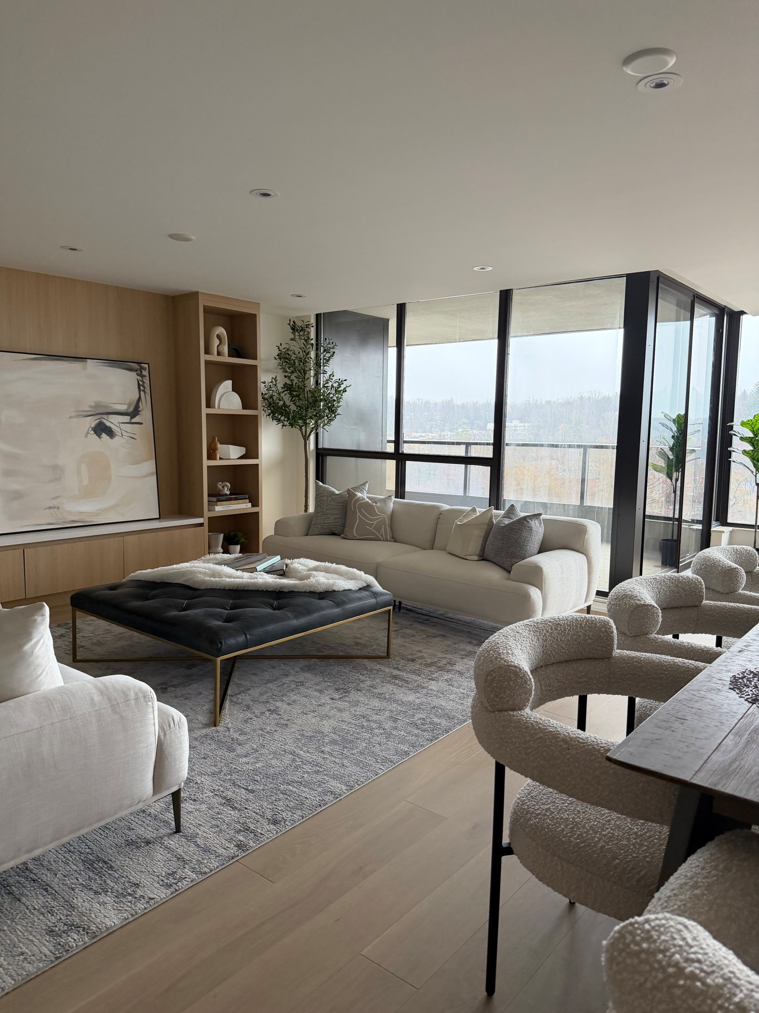 Modern contemporary condo staging that is timeless and liveable. Styled with all neutral decor in varying textures and heights. 

Would you live here? Would you change anything? Let me know in the comments.

Dining chairs, leather ottoman coffee table, sofa, loveseat, rug, living room, oversized art, faux tree, condo staging, luxury condo, elevated home decor, condo styling, decor styling, modern home
