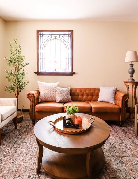 Living room furniture: faux leather couch, throw pillows, living room rug, coffee table, accent chairs 

#LTKFindsUnder50 #LTKHome #LTKStyleTip