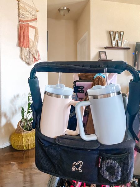 Got a stroller or wheelchair and need something to hold your Stanley tumbler? We love this organizer! It fits 2 Stanley tumblers, has a large compartment in the middle, and pockets in the front. So handy and perfect for anyone needing to free up their hands! 

#LTKsalealert #LTKFind #LTKfamily