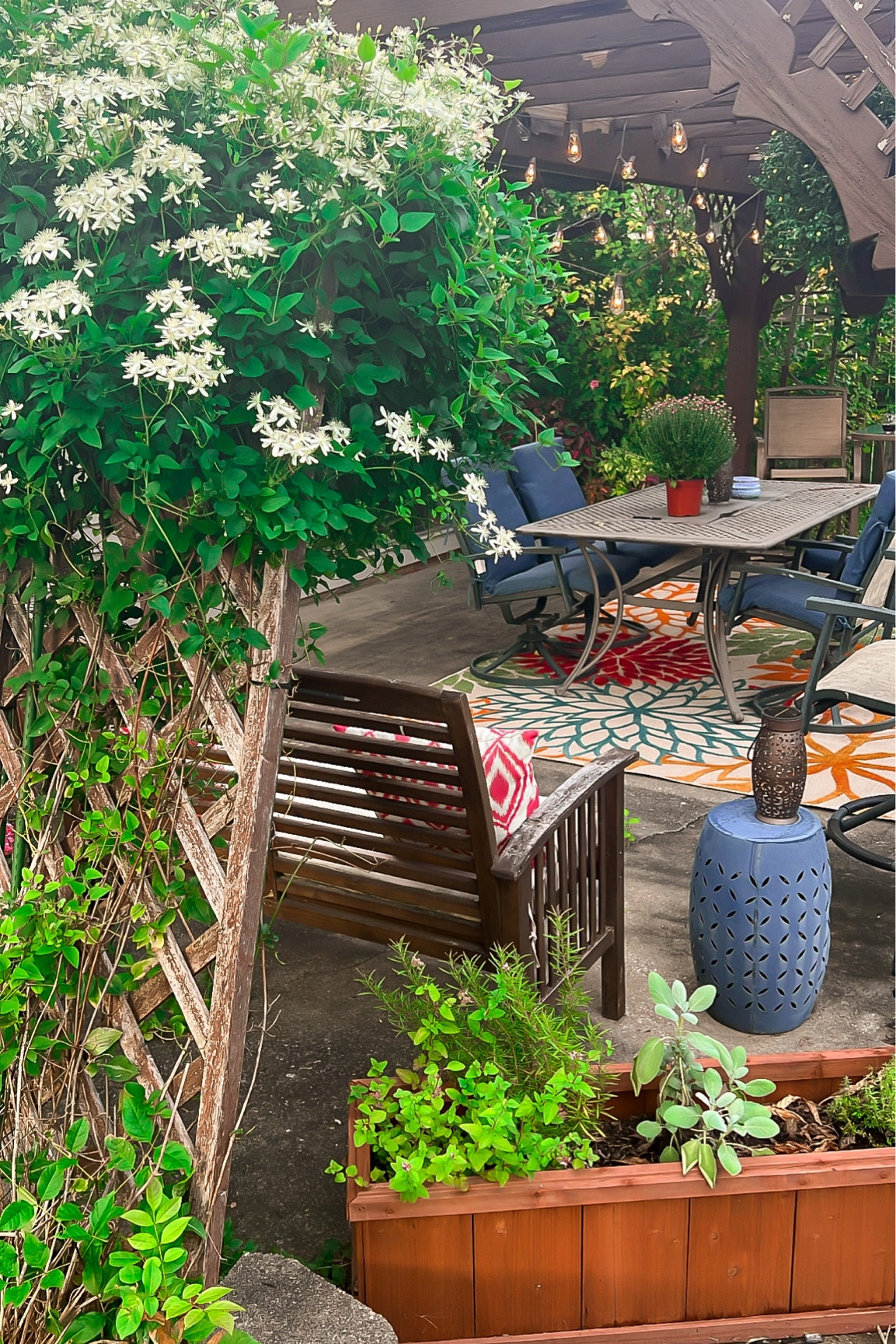 Late summer and early fall patio - Acacia wood bench - colorful outdoor rug - Edison bulb string lights outdoor - Amazon Finds 

#LTKunder100 #LTKhome #LTKunder50