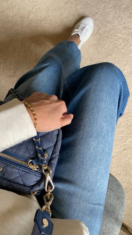Spring outfit. Spring outfits. Denim on denim. I love this cute little denim bag. Perfect size for everyday or travel. Comes with 3 straps. Organizational details. 
Jeans size down if in between. 
Chic white blouse size down. 
Code HINTOFGLAM to save on jewelry. 
Beaded necklace bracelet. 
White sneakers    

#LTKstyletip #LTKitbag #LTKover40