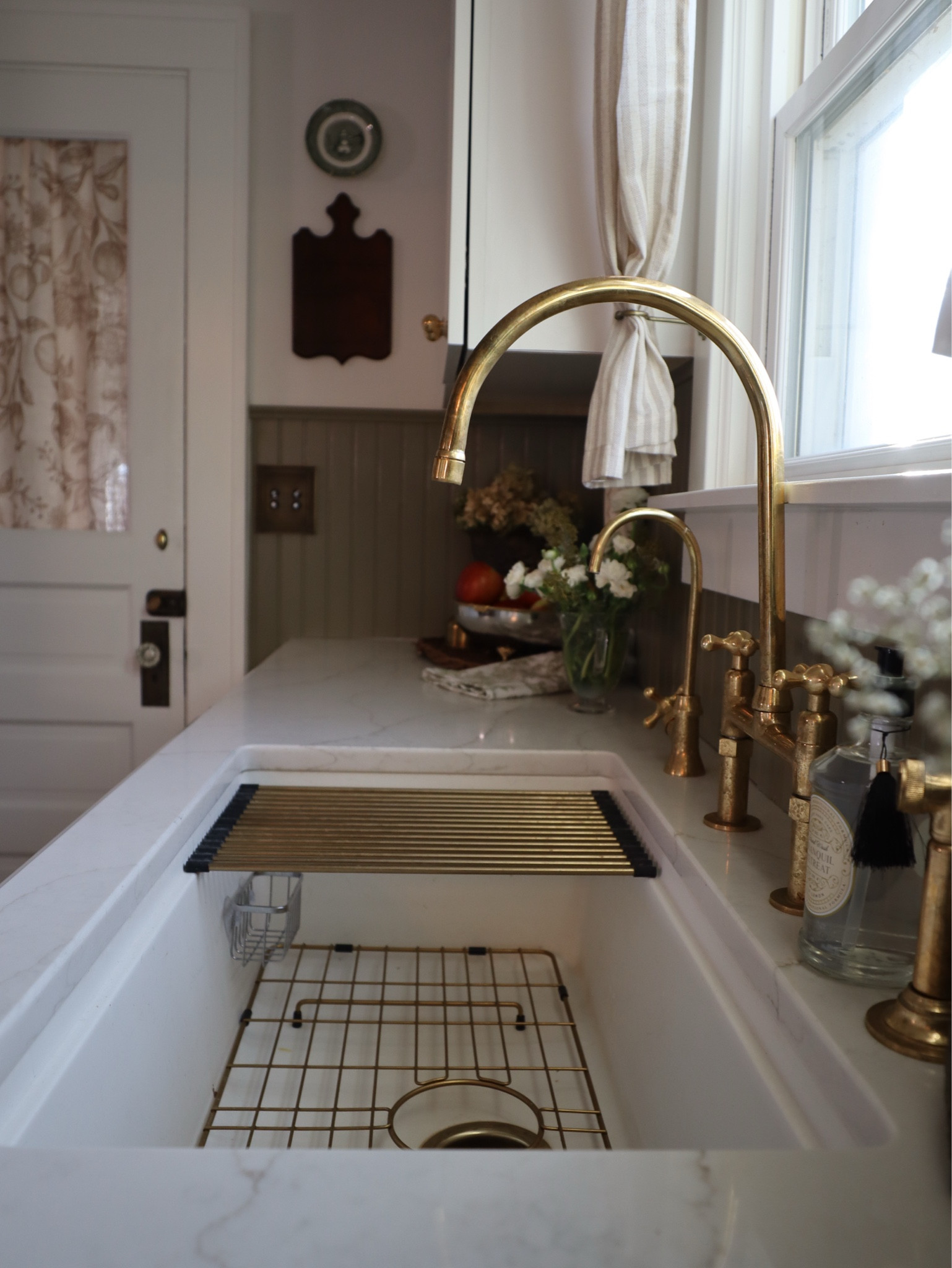 The perfect mix of timeless elegance and vintage charm ✨ This unlacquered brass faucet paired with a classic striped café curtains gives my kitchen an old-world feel that only gets better with time. Linking all my favorite kitchen details, from hardware to decor!

#LTKHome