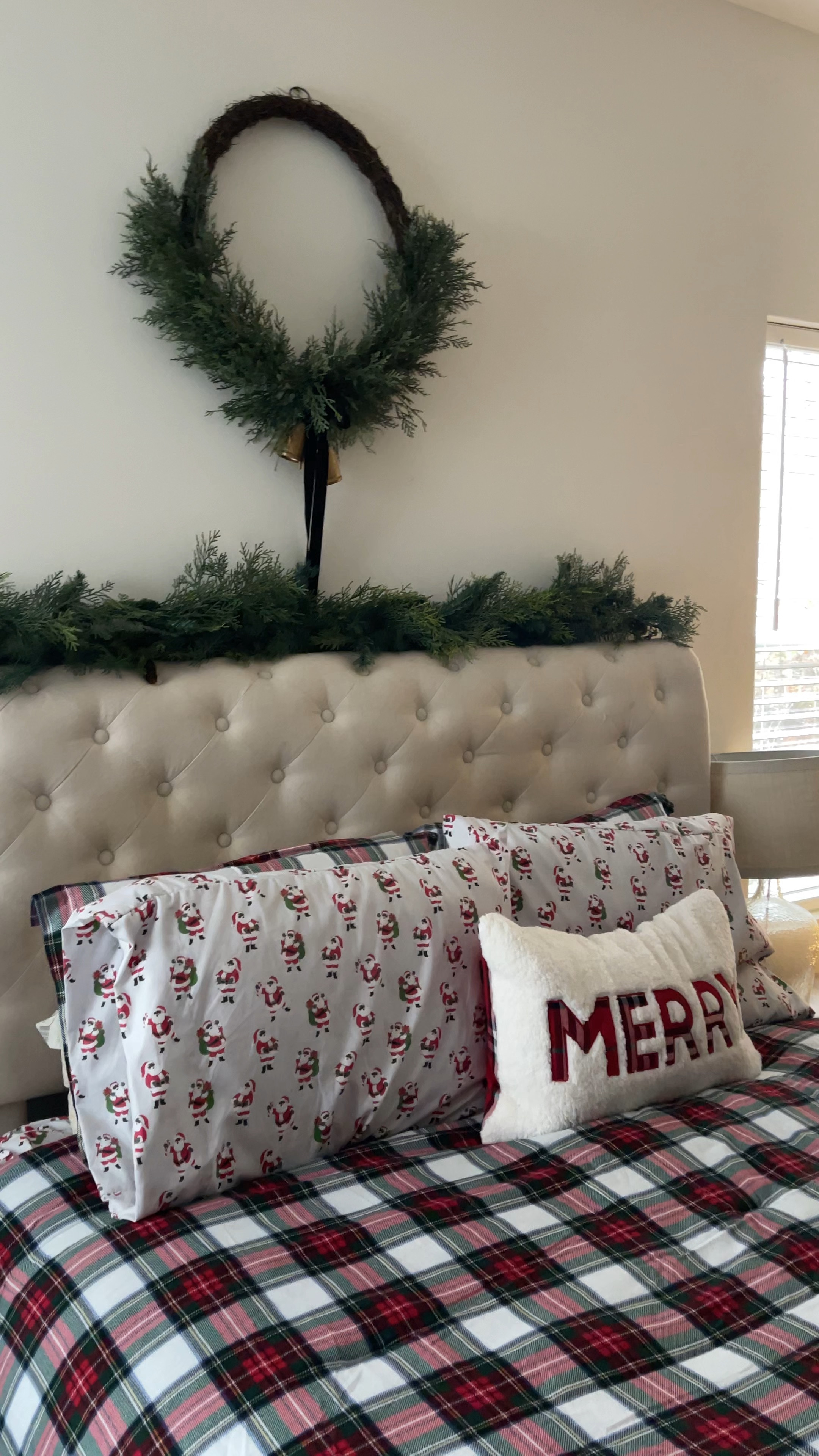 Cozy Christmas bedroom. Love my Stewart plaid flannel comforter and Santa sheets. Adding this large cedar wreath above our bed along with cedar garland is perfect. Our Christmas tree is decorated in a neutral theme and I used cedar stems in a vase to keep the cedar theme going lol 

#LTKHoliday #LTKhome #LTKVideo