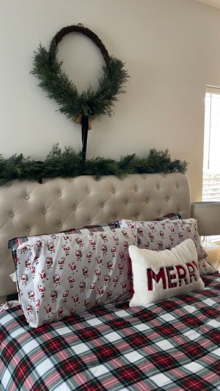 Cozy Christmas bedroom. Love my Stewart plaid flannel comforter and Santa sheets. Adding this large cedar wreath above our bed along with cedar garland is perfect. Our Christmas tree is decorated in a neutral theme and I used cedar stems in a vase to keep the cedar theme going lol 

#LTKHoliday #LTKhome #LTKVideo
