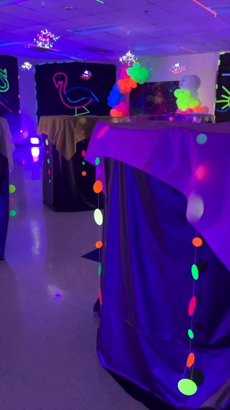 Party decor for a glow in the dark black light party. Paper garland that glows  

#LTKVideo #LTKparties