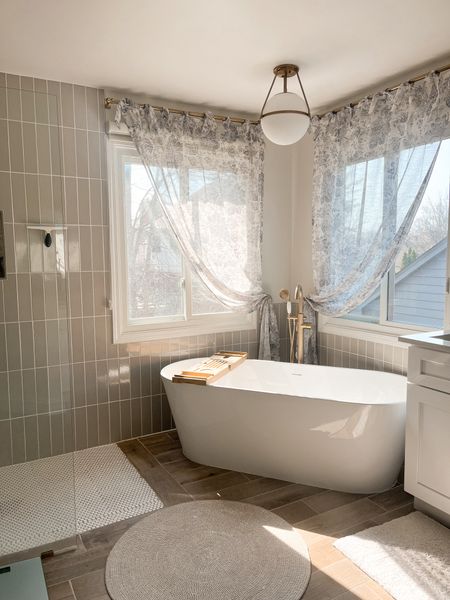 Are you doing a master bathroom remodel this spring? We did ours last spring on a budget of course. This is not our forever home. All the finishes were found at local stores, including the tub 🤗

#LTKhome #LTKSpringSale #LTKsalealert
