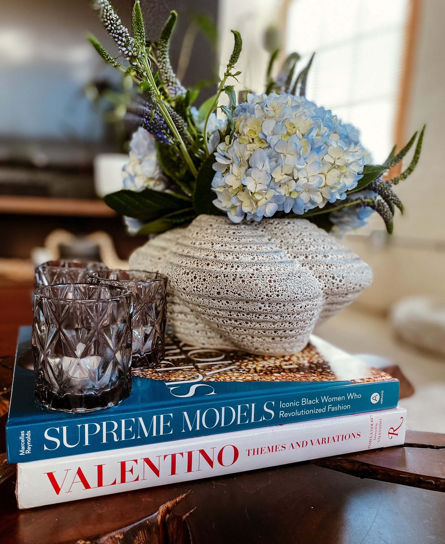 Coffee table center piece and decor. Tea light candle holders are on sale! #cb2 #homewhereyouare #iamstarrhoward #coffeetablebook 

#LTKSale #LTKhome #LTKsalealert