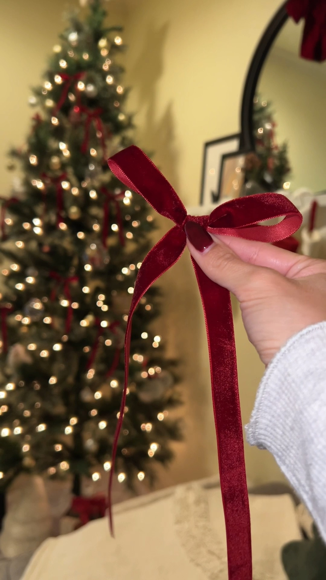 DIY christmas tree bows! 🎄❤️ 

used the 5/8” 20yd burgundy velvet ribbon from amazon and cut them at 27” in length for each bow 🎀 I made about 20 bows, but could have made more! 

#LTKHoliday #LTKHome #LTKSeasonal