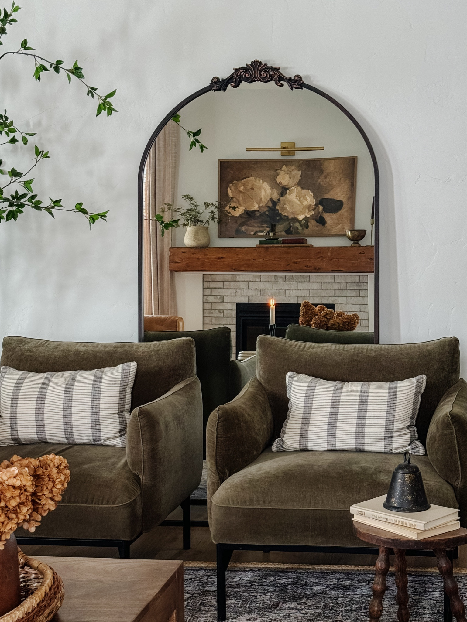 Frame TV, Samsung TV, Penn chairs, green accent chairs, nearly natural tree, floor length mirror, ornate mirror, wood square coffee table

#LTKstyletip #LTKhome #LTKsalealert