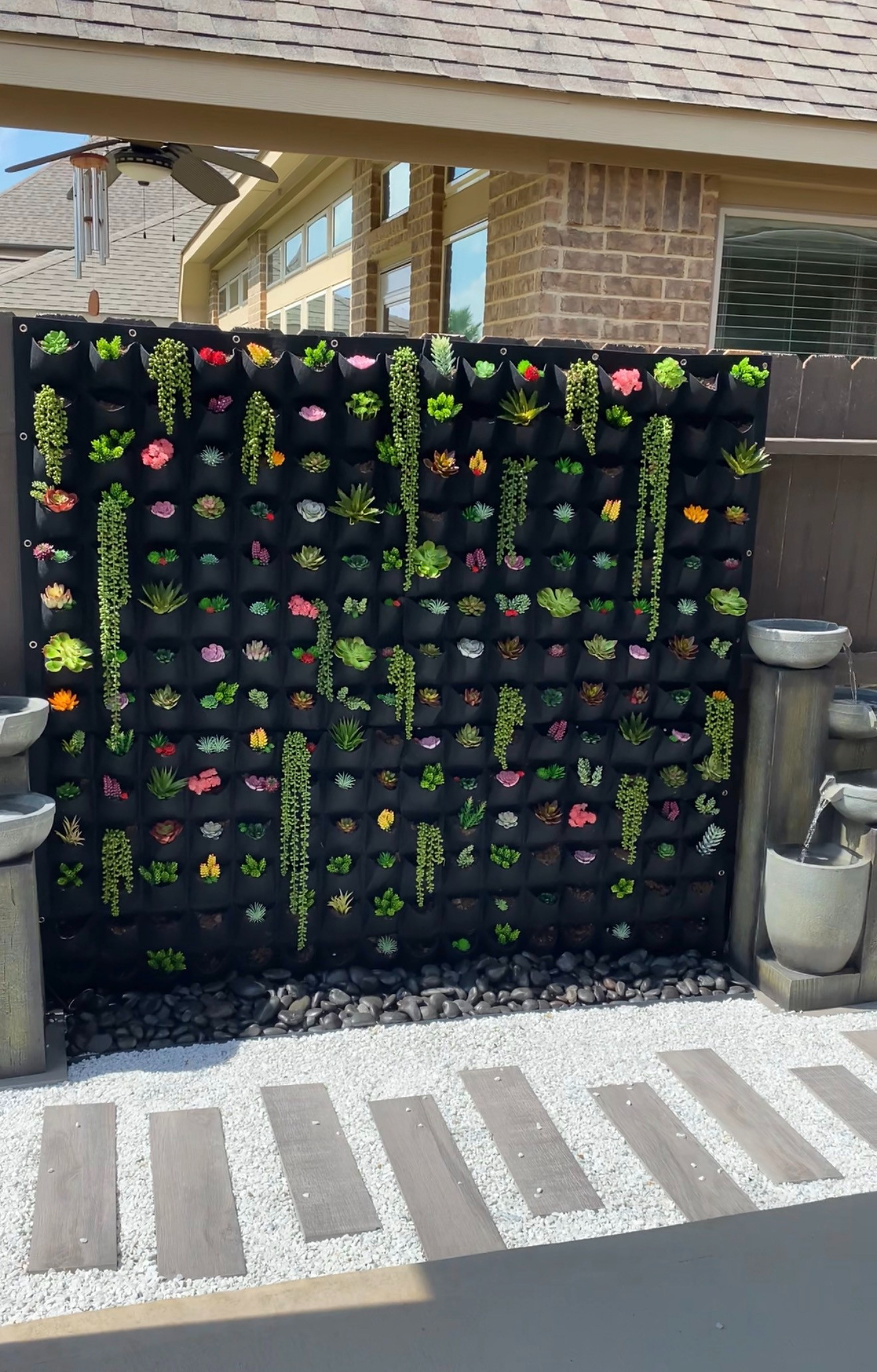 A vertical garden wall is the easiest way to elevate your outdoor space and add greenery without taking up extra room. The mix of textures and cascading plants creates a lush, curated look that feels both modern and organic 🌿 

 #LTKSeasonal #LTKActive #LTKHome