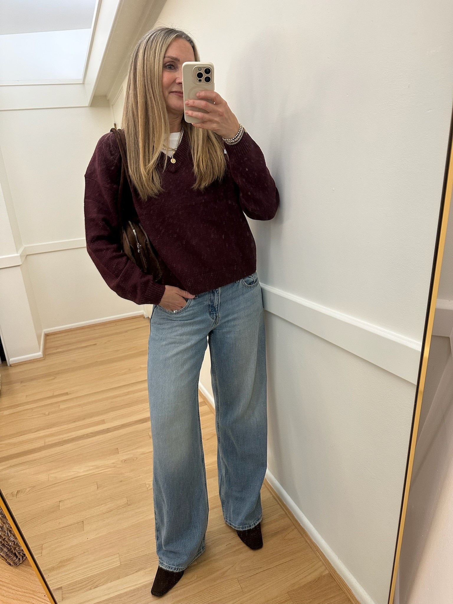 Fall outfits I’m actually wearing over 50! Jeans & boots are a fall staple, and I run cold, so most days I’m layering a sweater & white tee.