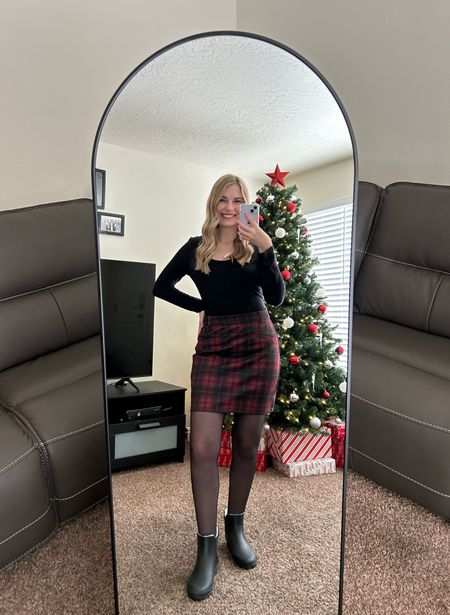 Christmas party outfit! Black top paired with a red buffalo plaid skirt, tights, and snow boots ♥️ This is also a great business outfit for the holidays!

#LTKparties #LTKHoliday #LTKworkwear