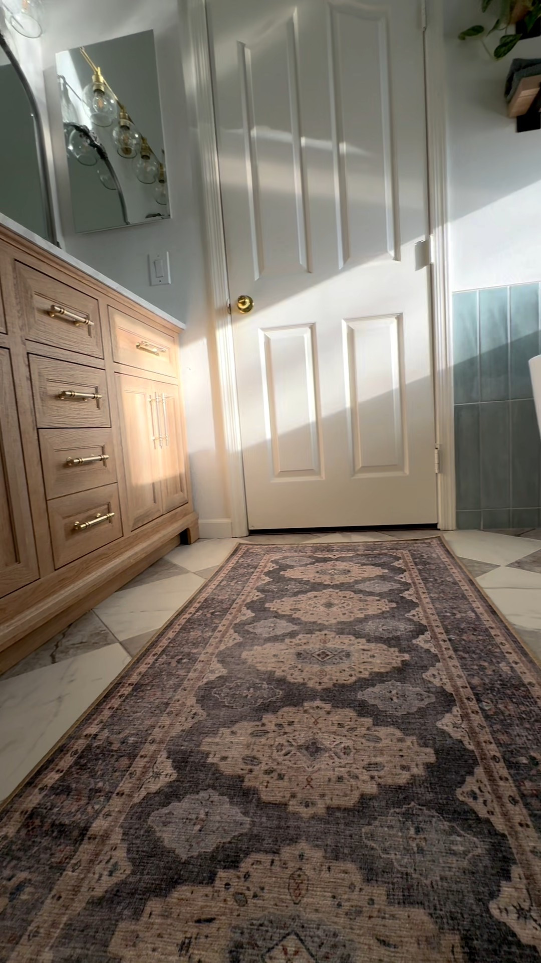 primary bathroom makeover with affordable checkerboard tile, standing tub, blue shower tile, light oak bathroom vanity & the perfect bathroom runner rug 

#LTKHome #LTKSeasonal