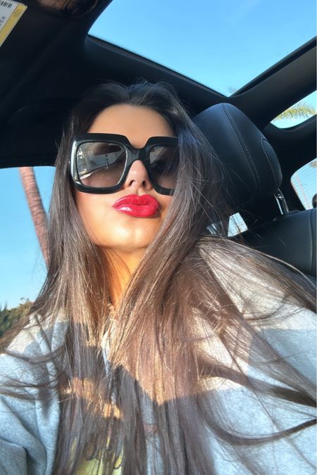 Fenty heat lip gloss in hot cherry 🍒 
Patrick Ta lip liner in she’s not from here 
Sephora
Beauty
Red lips
Gucci sunglasses 

#LTKStyleTip #LTKBeauty #LTKFindsUnder50