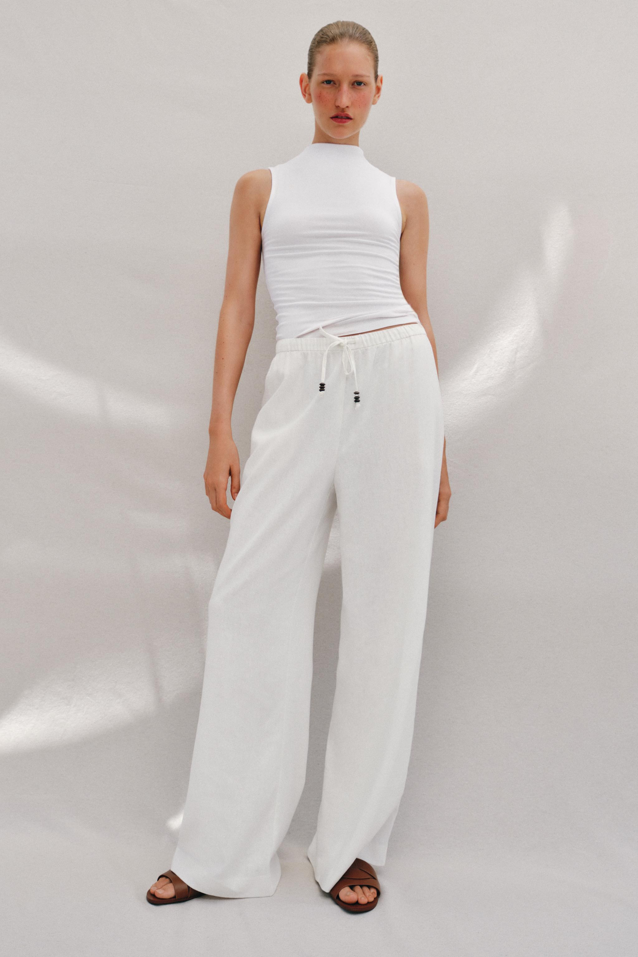 Trousers made of a linen blend. Mid-waist with adjustable elastic waistband and front pockets. St... | Zara UK