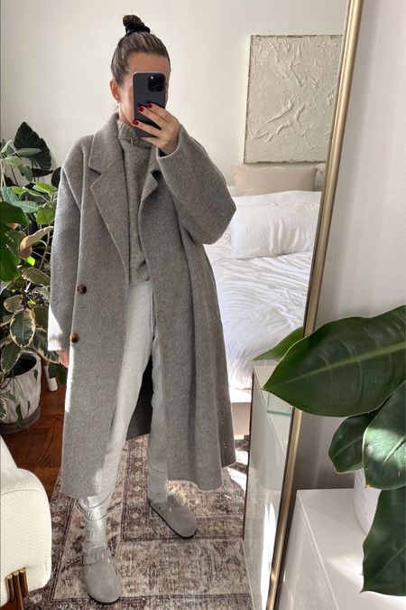 The sweater I am wearing is not recent but included a similar one! Coat is NAP Loungewear but sadly not available this year. Pants are the same as I am wearing! TTS. In the Birkenstocks, I recommend sizing up in this style.