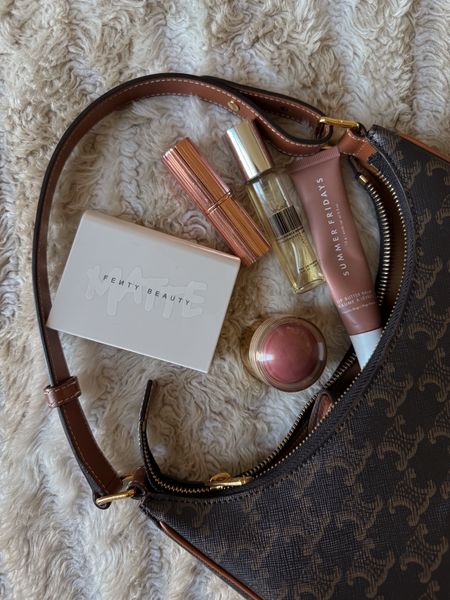 Beauty essentials in my purse and on sale during the Sephora sale code YAYSALE. Fenty setting powder which I especially love under the eyes since it blurs! Old faithful charlotte tilbury lipstick in pillow talk and summer Fridays lip butter balm plus Merit balm (have it in cheeky shown here and super pink color called Stockholm) and Dedcool Number 01 travel fragrance. This smells so so good and the size and packaging is perfect for my purse and layers well with any other fragrance I might wear  

#LTKsalealert #LTKbeauty #LTKxSephora
