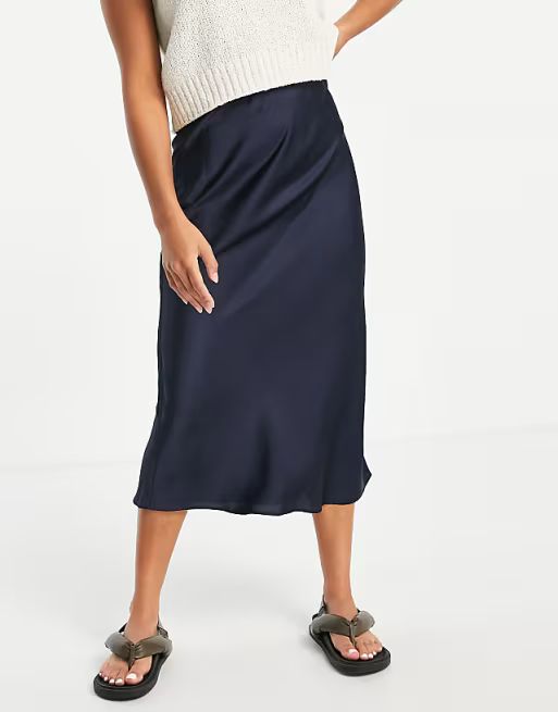 ASOS DESIGN Petite satin bias slip midi skirt in navy | ASOS (Global)