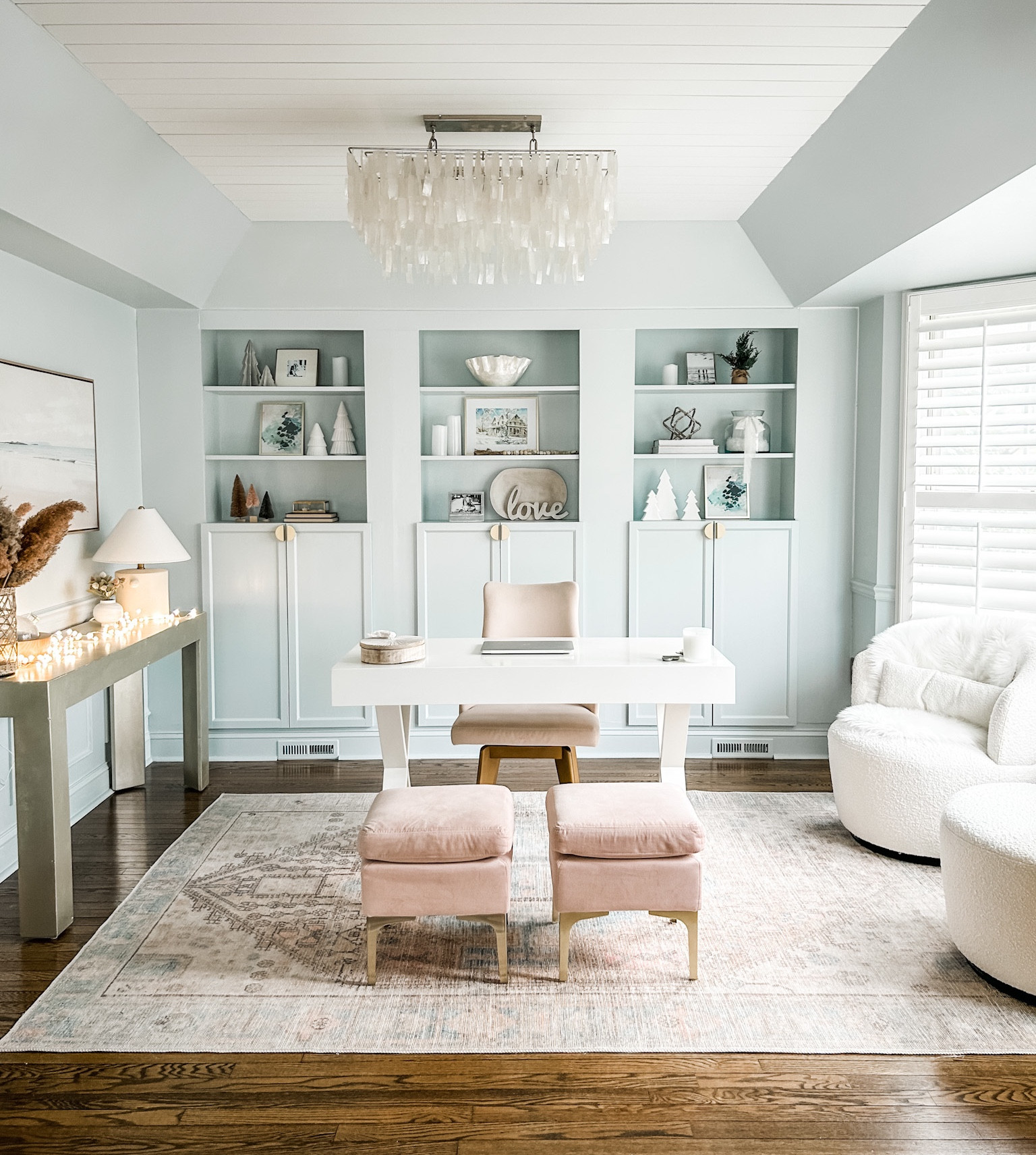 Coastal home office, blush area rug, capiz chandelier, coastal chandelier, shell chandelier, wall art, framed canvas wall art, landscape wall art, neutral wall art, shelf decor, white x-crossed legs desk with drawer, neutral decor. Desk decor. Target. West Elm.

#LTKFind #LTKhome