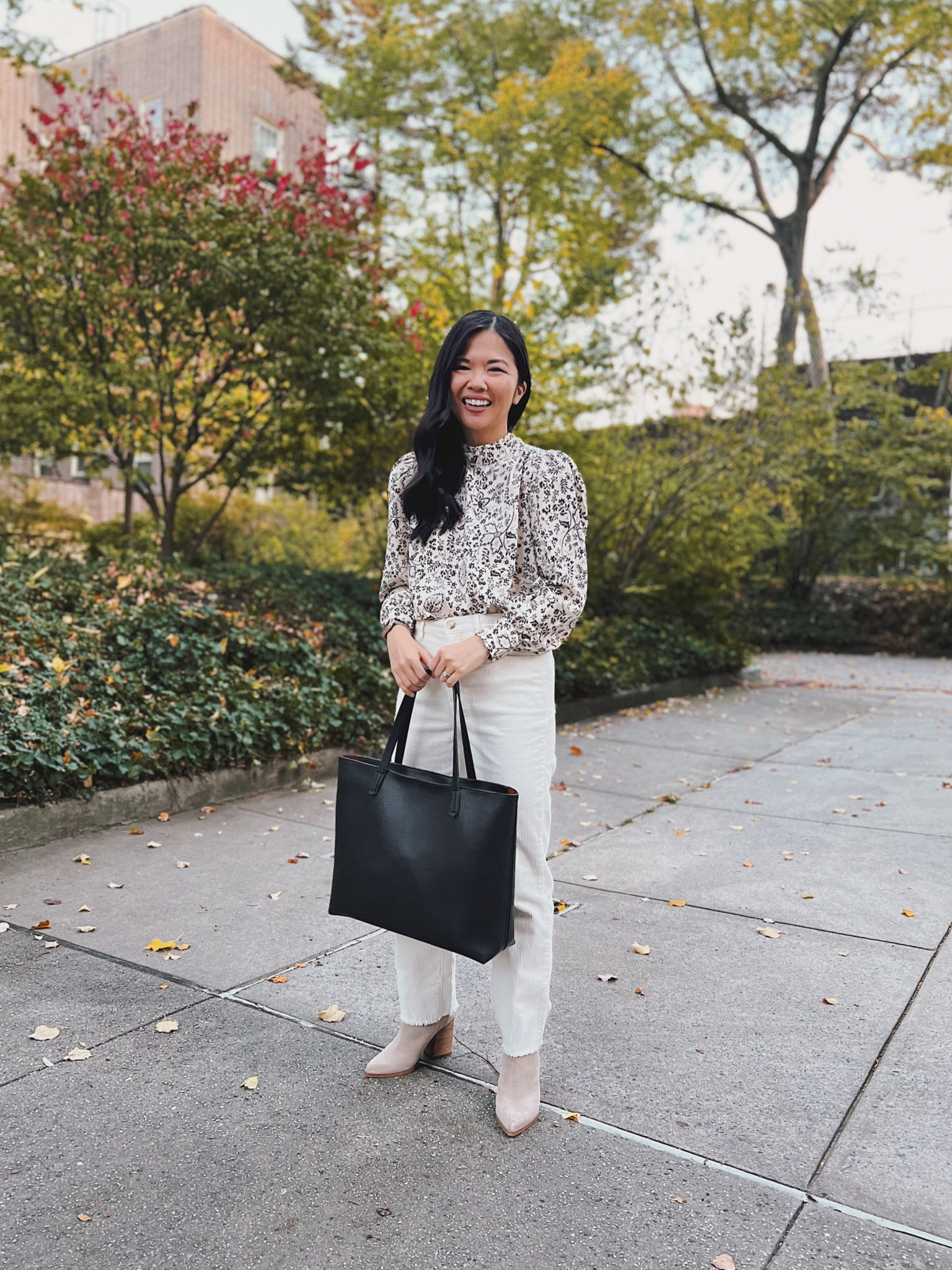 Business casual outfit, smart casual, LOFT, fall outfit, teacher outfit: black and white floral blouse (XS), cream corduroy pants (27), black tote bag, taupe ankle booties.

#LTKworkwear #LTKSeasonal #LTKunder100