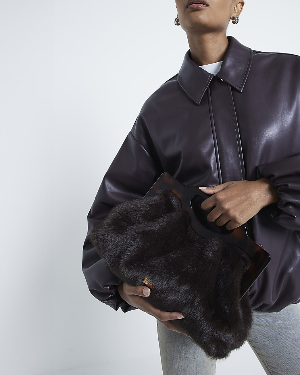 Brown faux fur Frame handle clutch bag | River Island (UK & IE)