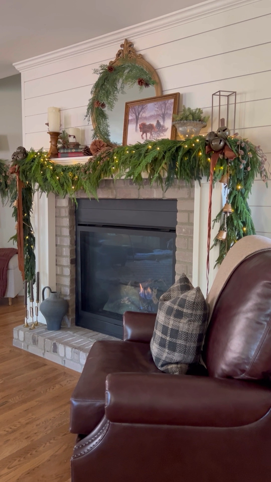 Snuggled up by the fire, surrounded by my cozy Christmas mantel magic! 🎄✨ I went all out with 7 realistic garland greenery, twinkling rice lights, and a few vintage touches that make my farmhouse-loving heart so happy. That wreath on the mirror? Just the cherry on top of the holiday vibes! And let’s not forget my favorite leather chair, complete with a plaid pillow and cozy throw—perfect for fireside lounging. Bring on the cocoa and Christmas movies! 🎅🔥 #FarmhouseChristmas #HolidayDecor #CozyVibes

#LTKSeasonal #LTKHoliday #LTKHome