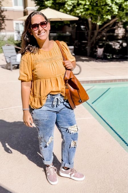 Mustard yellow peasant top. Patched ripped jeans. Lilac sneakers. Leather tote. 

#LTKmidsize #LTKshoecrush #LTKitbag