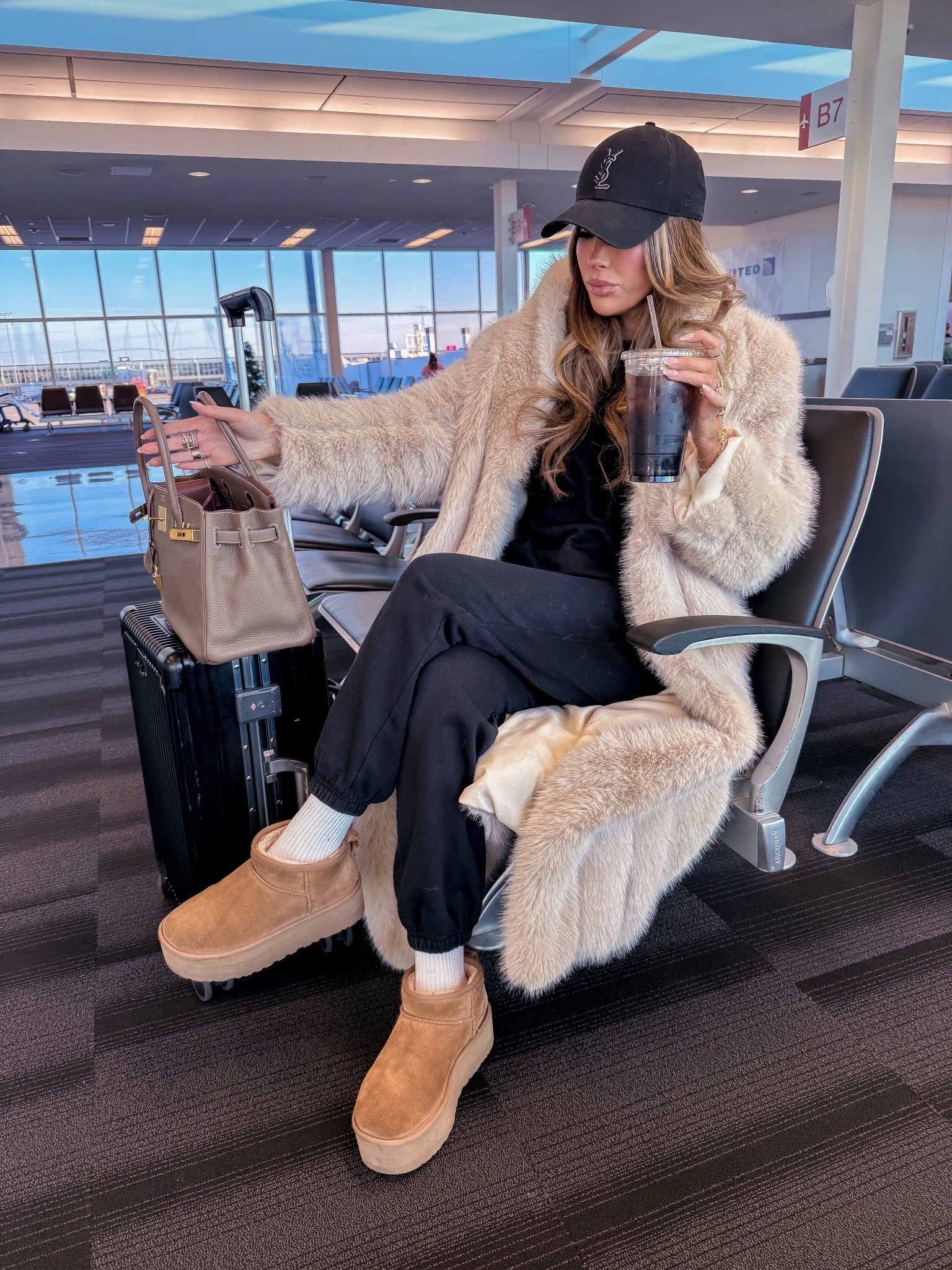 Bringing back this winter travel outfit! One of my favorites. Wearing XS in my set and a small in my faux Fur coat! 🖤

Winter outfit idea, faux fur coat, birkin 30 ETOUPE, cute travel outfit, travel outfit idea, airport outfit idea, Emily Ann Gemma, travel style, winter travel airport outfit, alo sweatsuit, Ugg mini platform ultra, YSL baseball cap

#LTKTravel #LTKootd