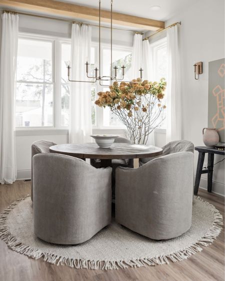 Covered chairs make a dining space feel cozy and welcoming .

#LTKhome