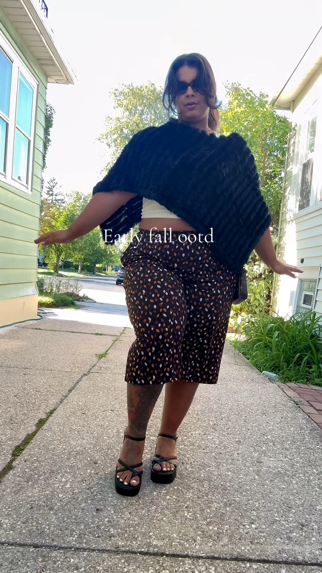 ✨ Fall Fashion Inspo ✨
Cozy yet elevated, this look is perfect for transitional weather! I styled a chunky black knit poncho over a sleek white top for a chic layered vibe. These high-waisted, wide-leg gaucho in a warm brown abstract print add a playful pop of pattern, while strappy black platform sandals elongate the legs and tie everything together. Perfect for a mid-size/plus-size fall outfit, coffee runs, or a night out! 🍂

🖤 Shop the Look:
• Textured knit poncho – cozy layering essential
• White tank top – versatile base piece
• Printed culottes – statement bottoms for fall
• Black platform sandals – retro 2000s vibes, comfy but stylish
• Mini shoulder bag – perfect finishing touch

#FallStyle2025 #PlusSizeStyle #MidSizeStyle #OOTD #FallFashionInspo #EffortlessChic #StyleForAll

#LTKMidsize #LTKPlusSize #LTKSeasonal