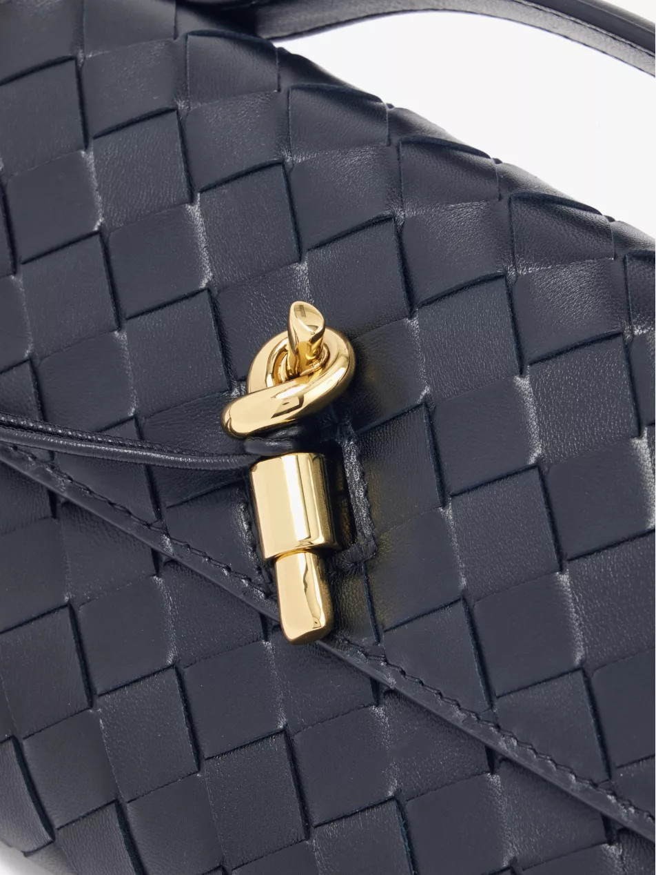 Andiamo Long intrecciato-weave leather clutch | Selfridges