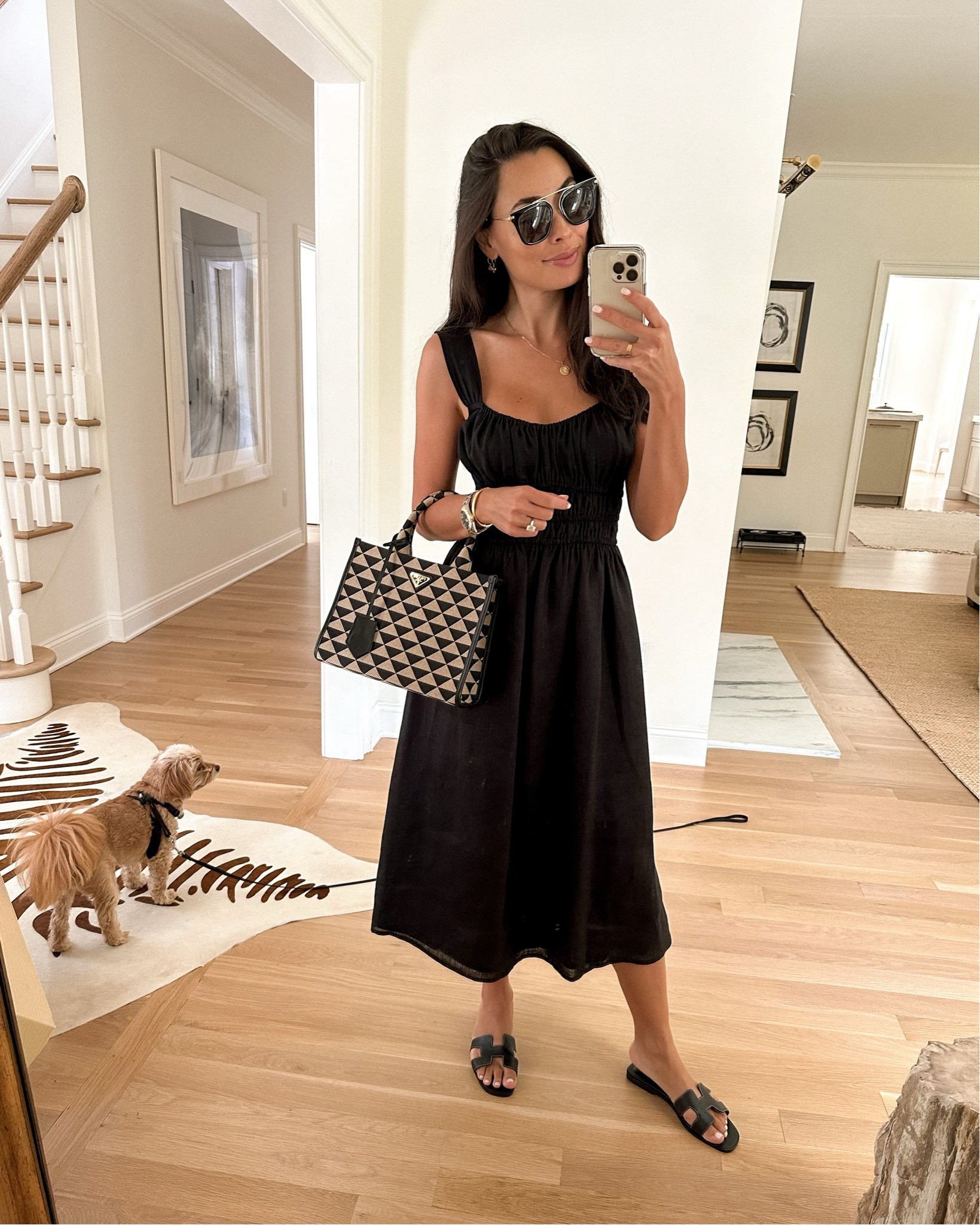 Kat Jamieson wears an easy black dress and Prada bag. 

#LTKworkwear #LTKitbag #LTKSeasonal