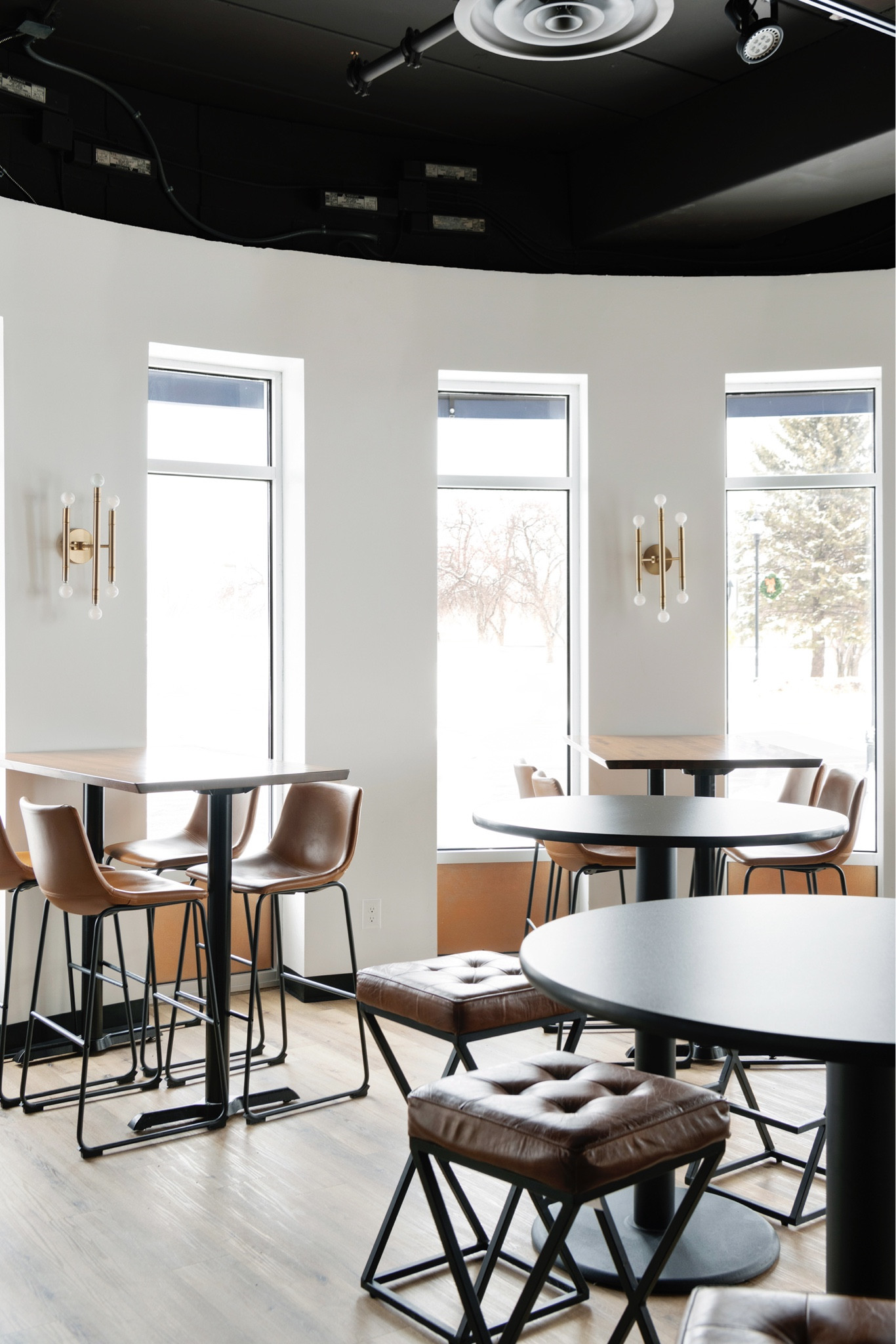 Faux leather bar stools & wall sconce lighting - coffee shop vibes for any home.