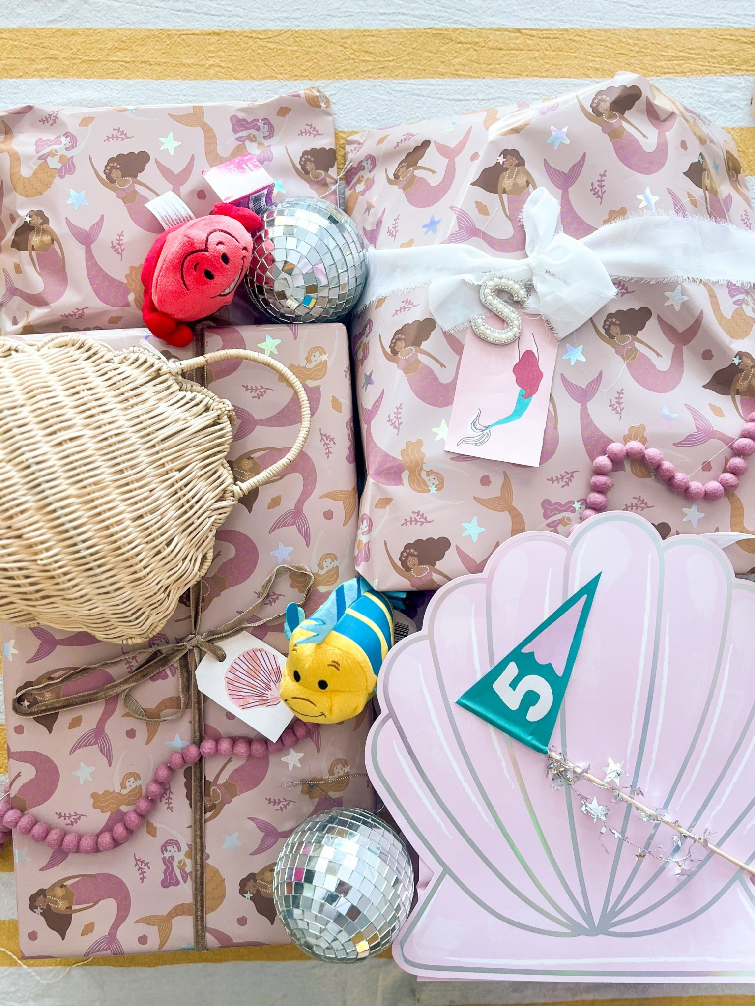 Is it even a Little Mermaid party if the gifts aren’t wrapped in mermaid/shell gift wrap? 🐚🦞

#LTKParties #LTKFamily #LTKKids
