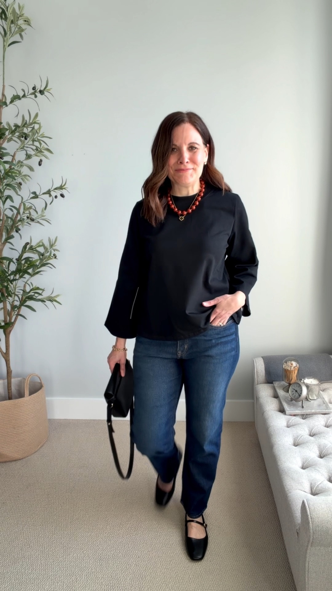This simple black top from Tuckernuck has an A-line shape, a slightly thicker, forgiving fabric, and hits just below the hip bone. The bell sleeves add interest; they hit a little higher on the arm to show off the wrists. I ordered my true size (small), and it fits with a relaxed shape. It also comes in white. These J.Crew Factory midrise straight jeans fit true to size. 

#LTKMidsize #LTKOver40