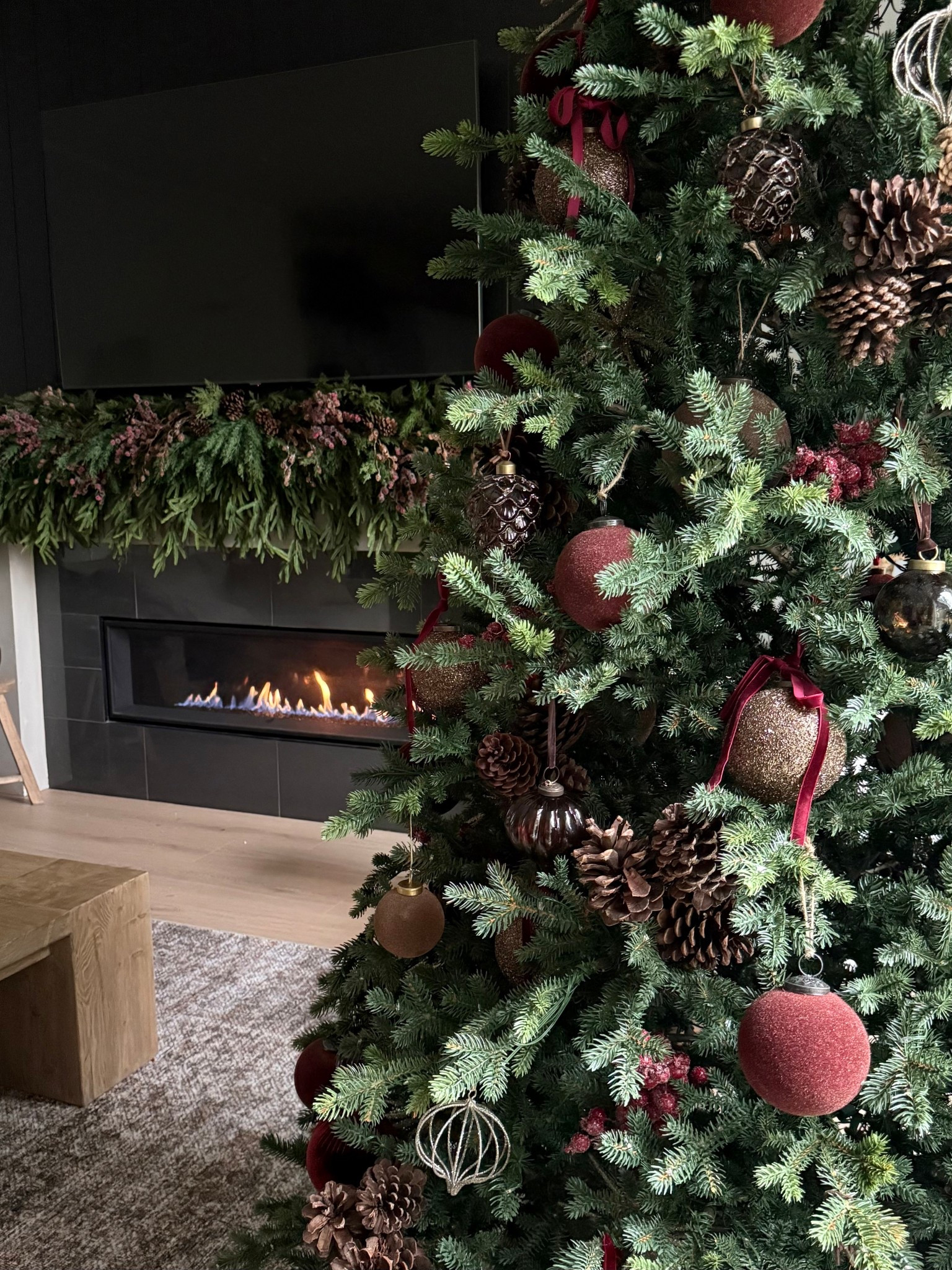 Moody tree.. dark and deep tones of burgundy and brown. a bit of velvet, a bit of shimmer… and a touch of organic with pinecone clusters.
Christmas tree inspiration 
Holiday home 

#LTKHoliday