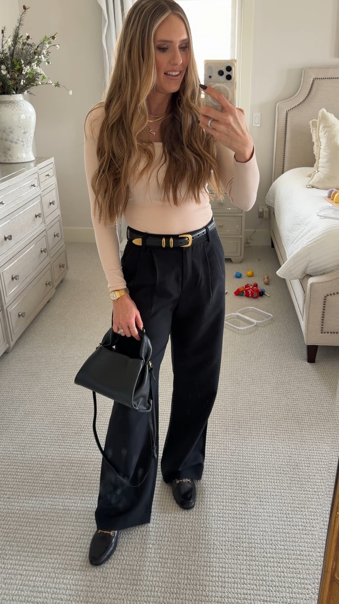 Dressing up with remaining super comfortable. Slacks, long sleeve ribbed tee, black purse, black loafers, classic look. All items are true to size. 