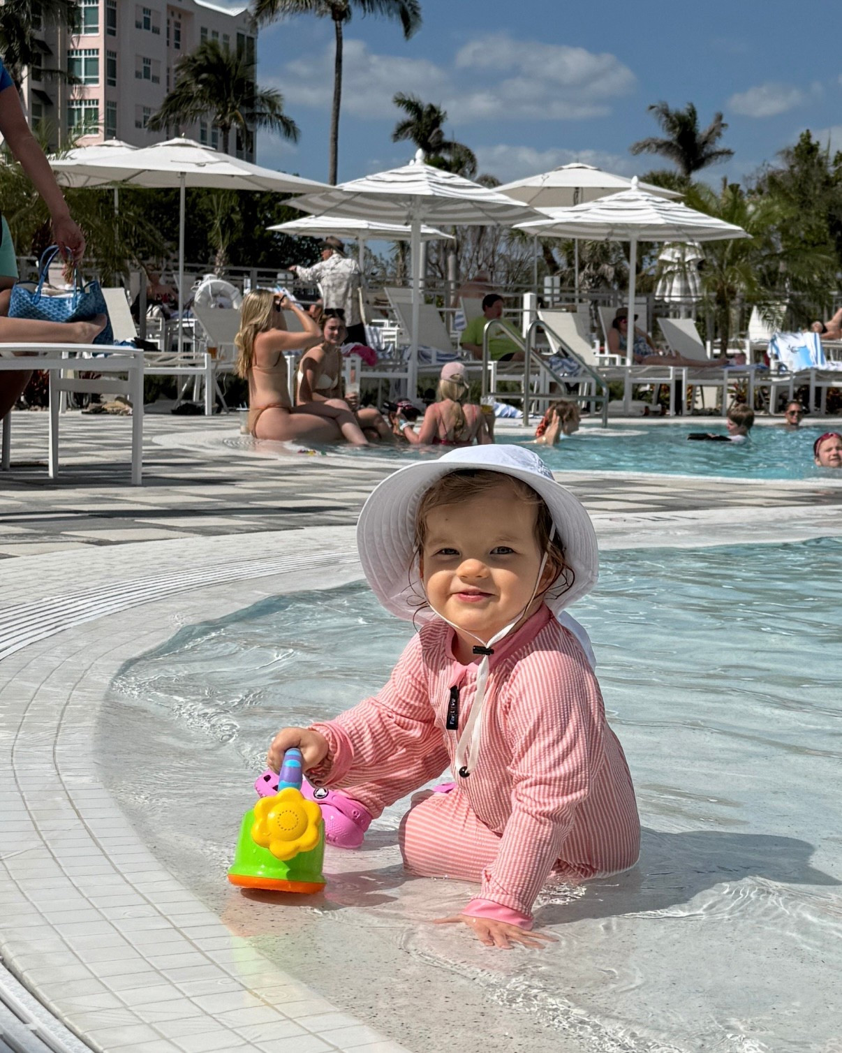 SPF is so important for littles!  She is wearing weVSwe Baby Girl Toddler Rash Guard Swimsuit and jerague Toddler Kids Baby Girl Breathable Sun Hat Cotton Foldable 50+ SPF Protective #spf #kidsafe 