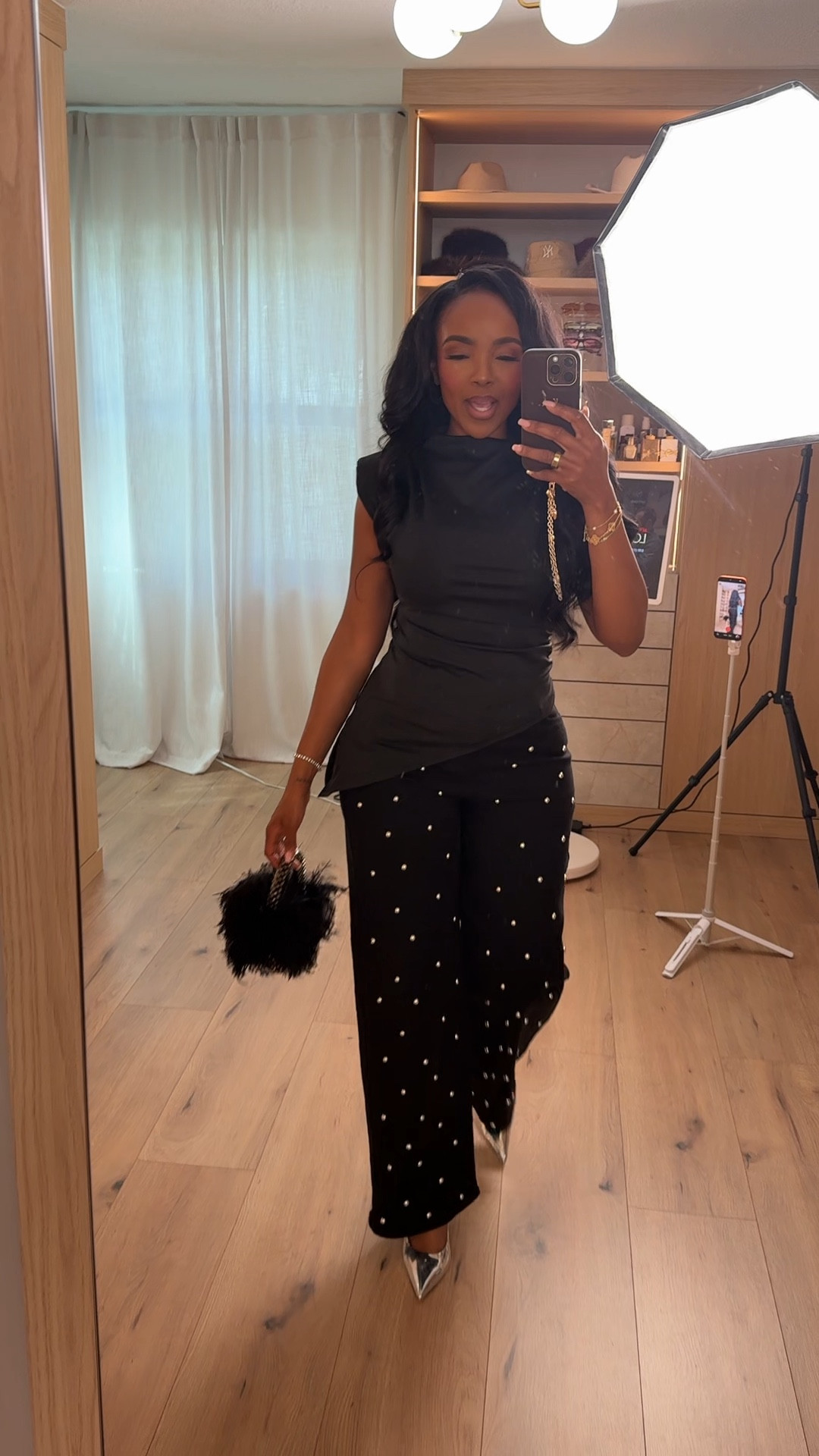 Monochrome but make it powerful 🖤 A structured black top paired with pearl embellished trousers is the kind of look that feels polished, elevated, and intentional. The subtle detailing on the pants adds texture and dimension, and when styled with heels, boots, or a blazer, the cost per wear keeps dropping.

The sleek silhouette keeps everything streamlined while the statement accessories give it that fashion-forward edge. This is one of those outfits you can repeat for multiple occasions and just switch the vibe.

Perfect for: date night, birthday dinners, cocktail events, girls’ night, holiday parties, and elevated evening looks.

📏 Sizing:
Wearing size Small in the top  
Wearing 27 Long in the pants  

📐 Measurements:
5’4” · 138 lbs · 34D · 27” waist · 40” hips  

Save this post to recreate later.

This post includes pearl embellished pants, black monochrome outfit, statement trousers, dark wash denim alternative, silver heels styling, chic evening outfits, elevated basics, and date night outfit inspiration.

Follow me on Instagram and YouTube @kirasfashionfinds